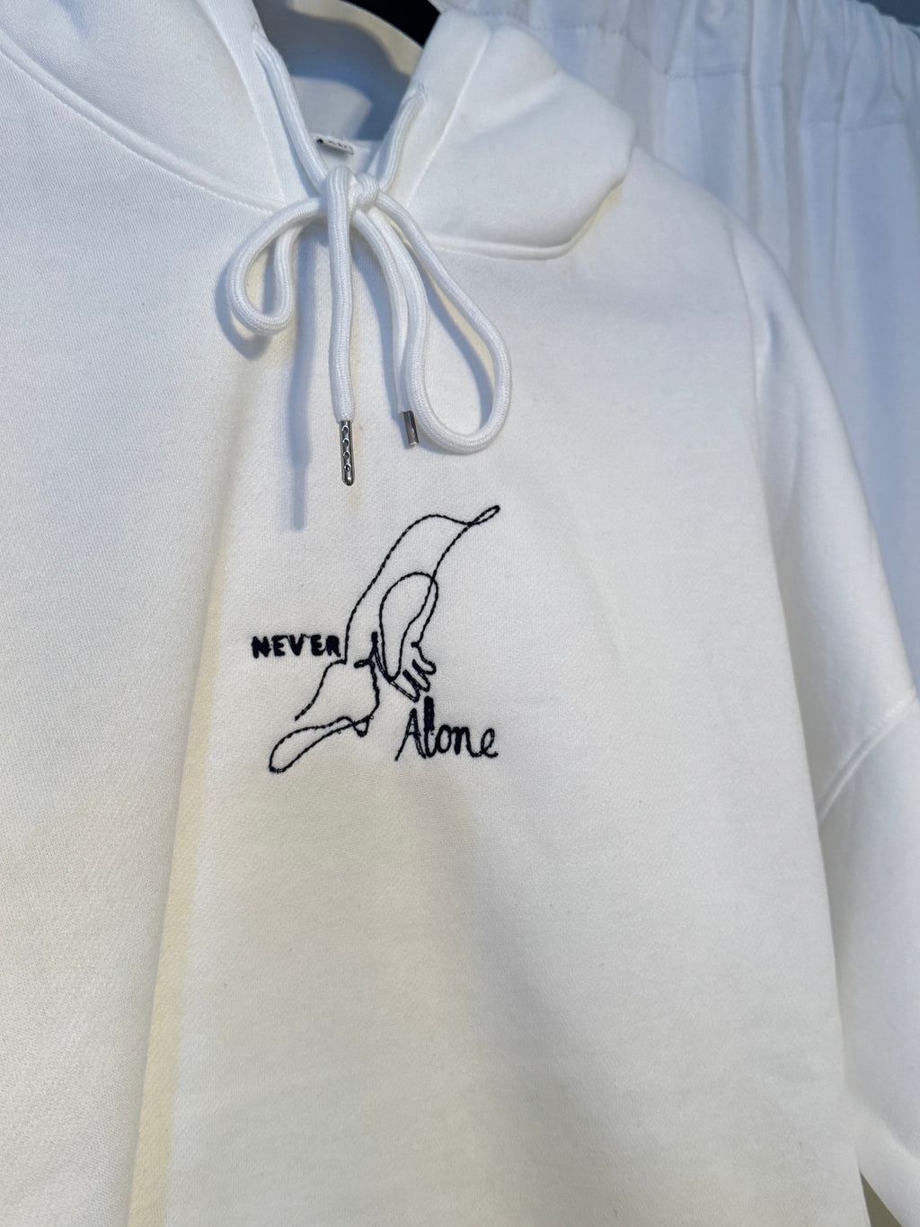 Never Alone Hoodie (holding jesus finger)